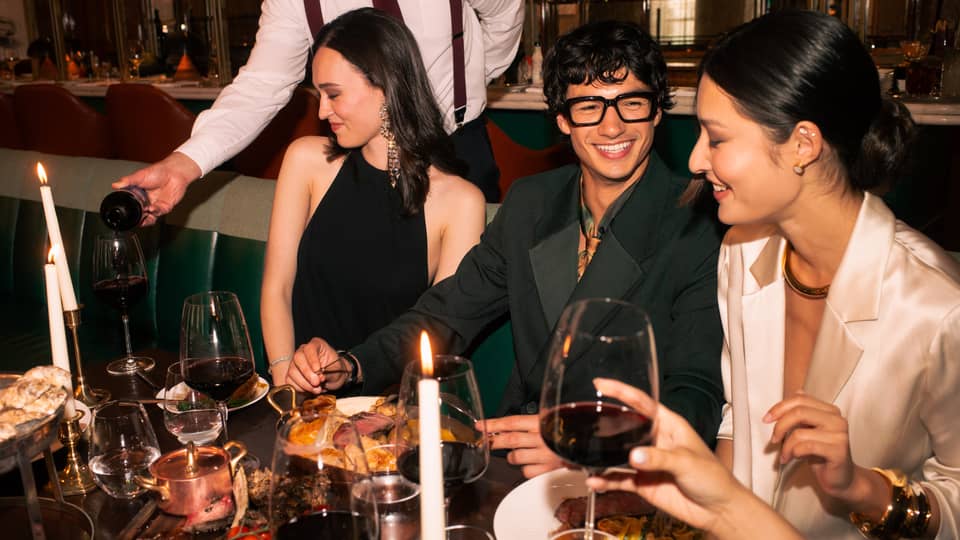 Group of friends dine at chic restaurant