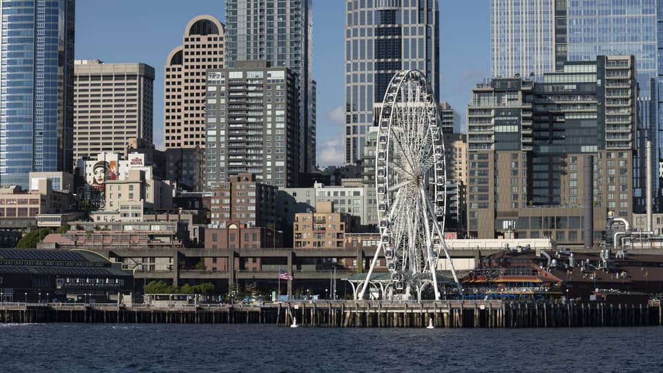The Seattle Great Wheel stands out among skyscrapers on Elliott Bay