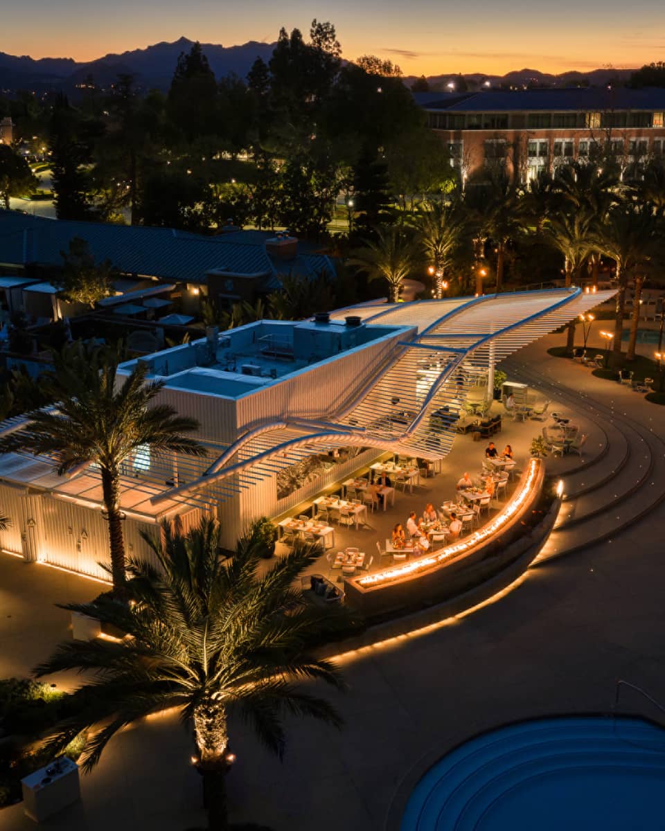 Aerial view of outdoor poolside restaurant at night