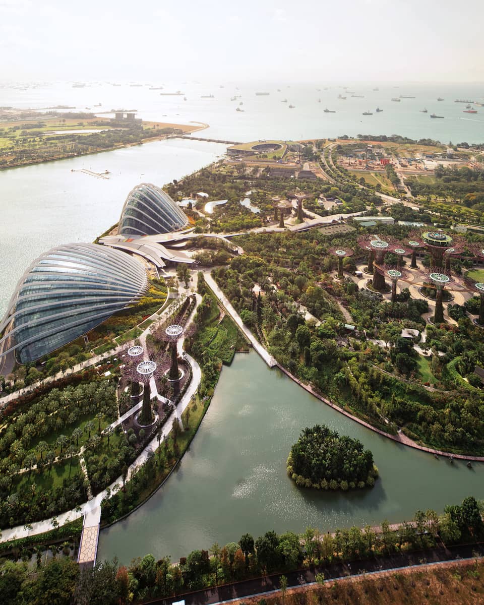 Aerial view of Singapore Gardens by the Bay trees, paths, glass domes by water