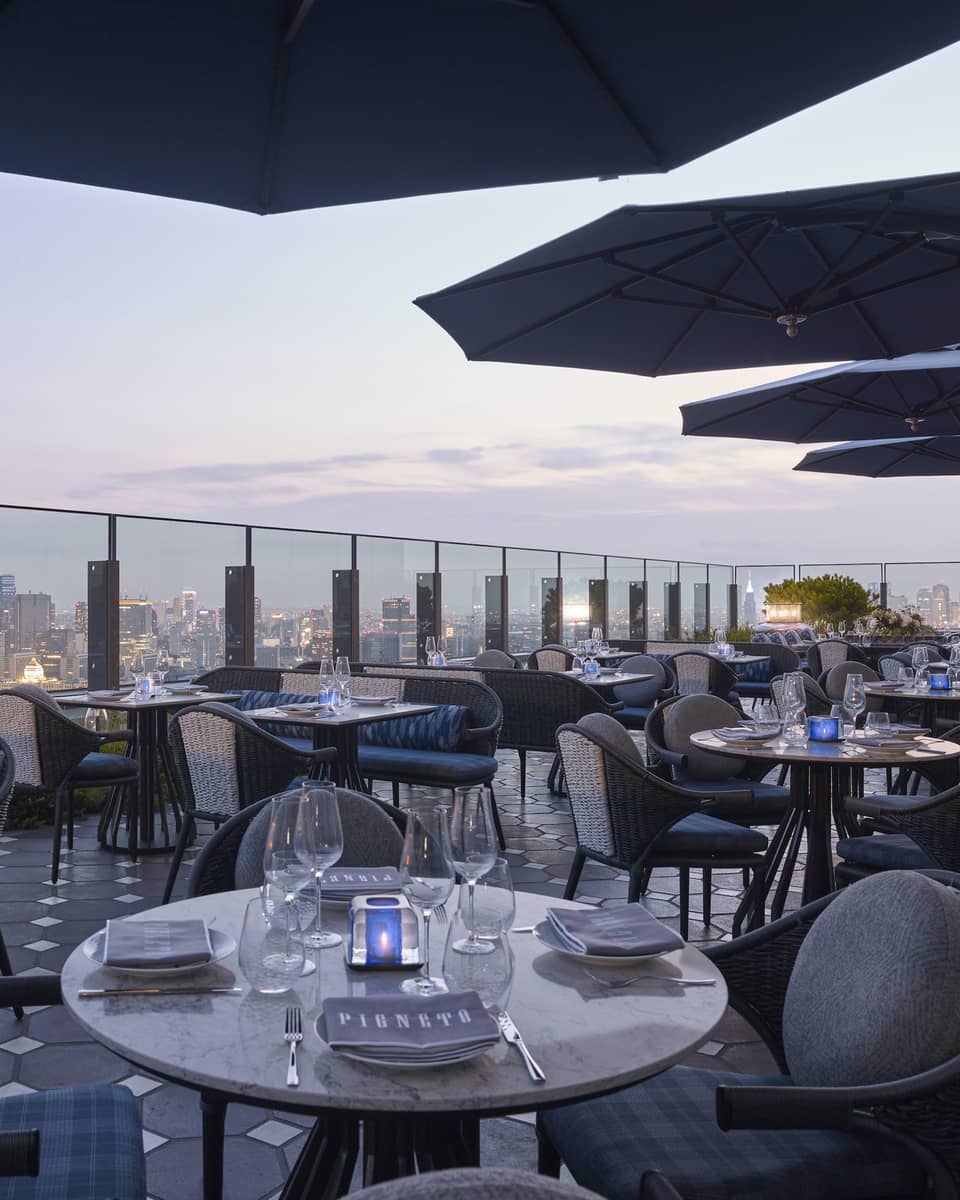Four Seasons rooftop restaurant with a city skyline views at dusk