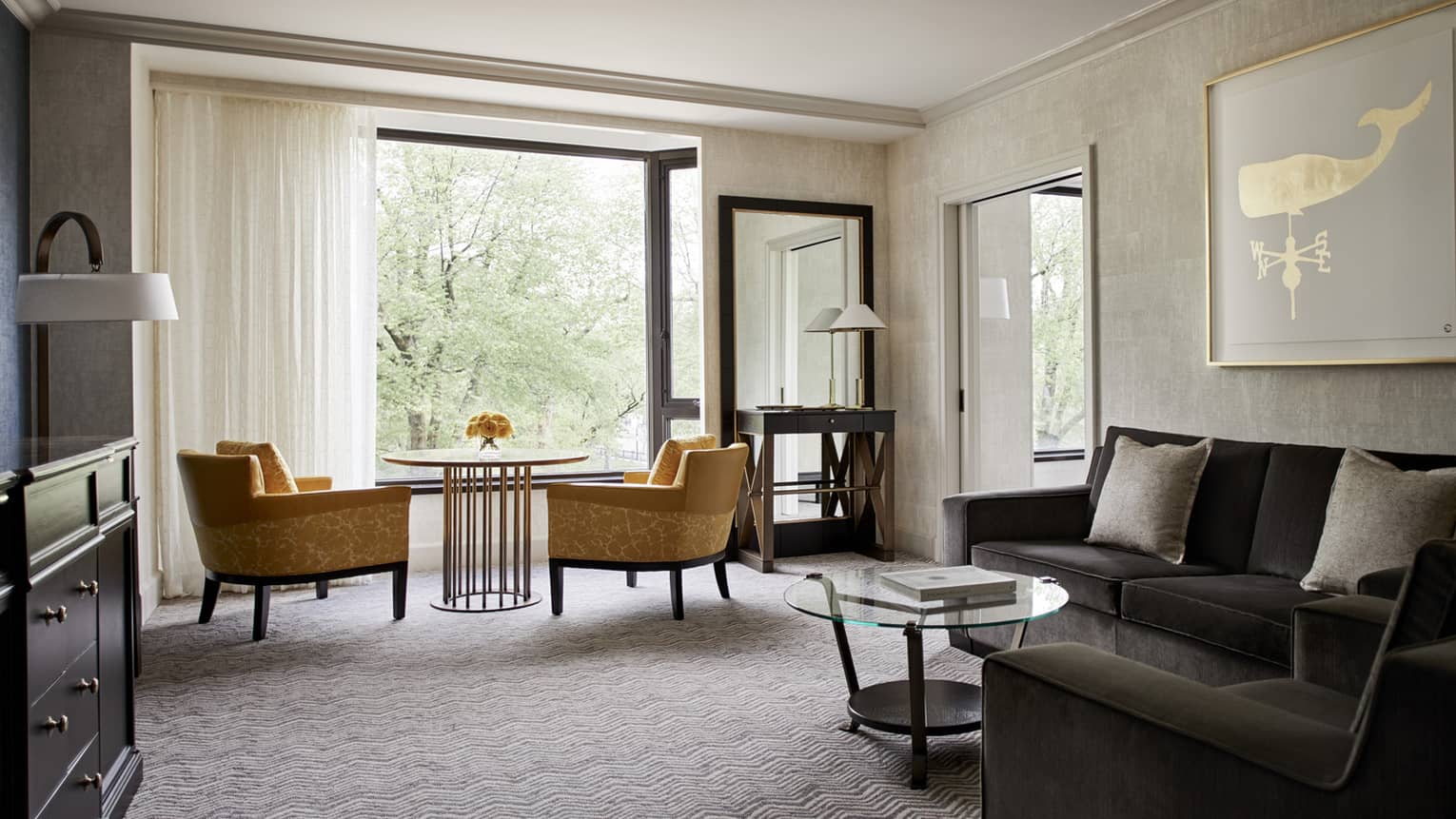 Luxury hotel room and honeymoon suite with orange armchairs and modern decor