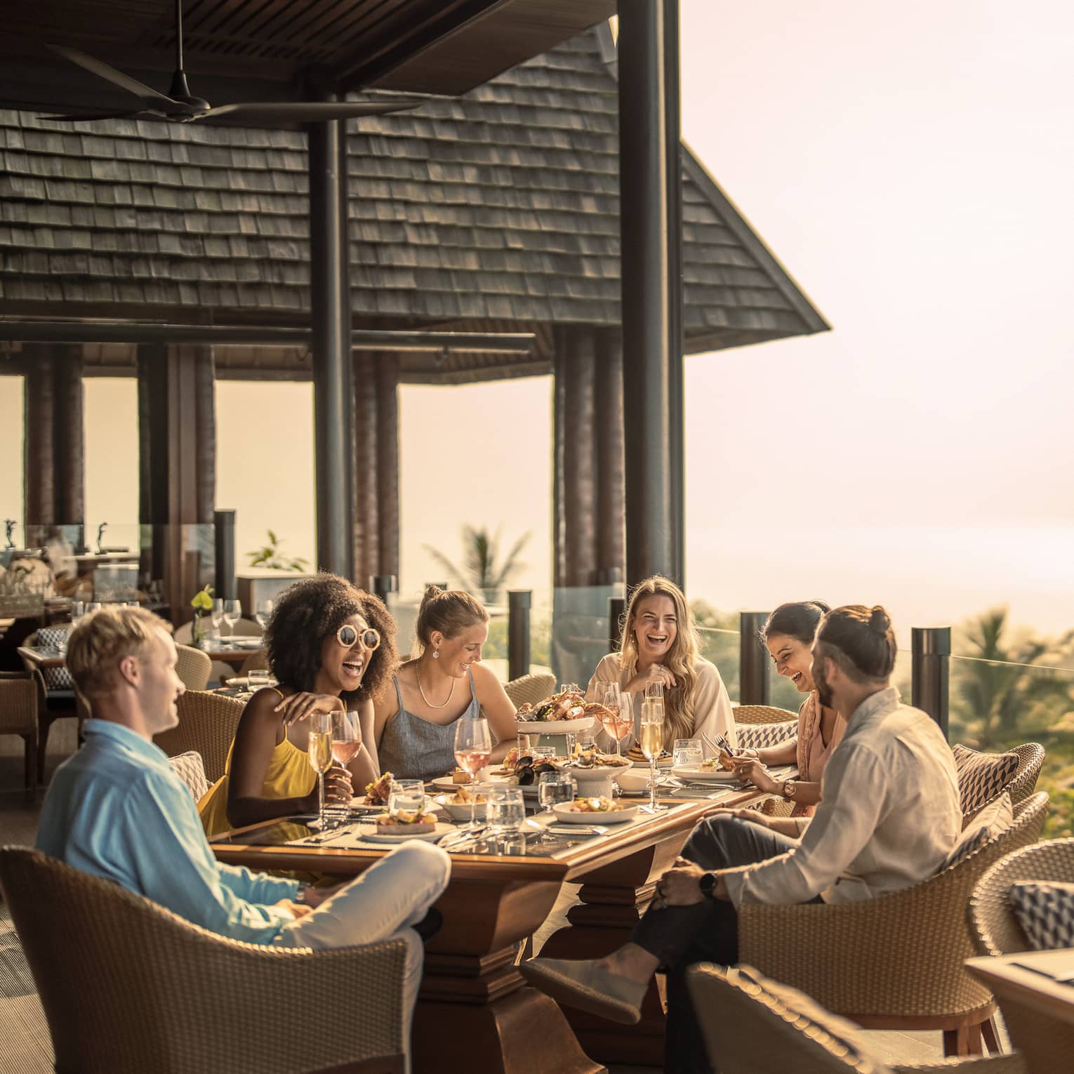 Group of friends enjoys outdoor traditional Thai brunch
