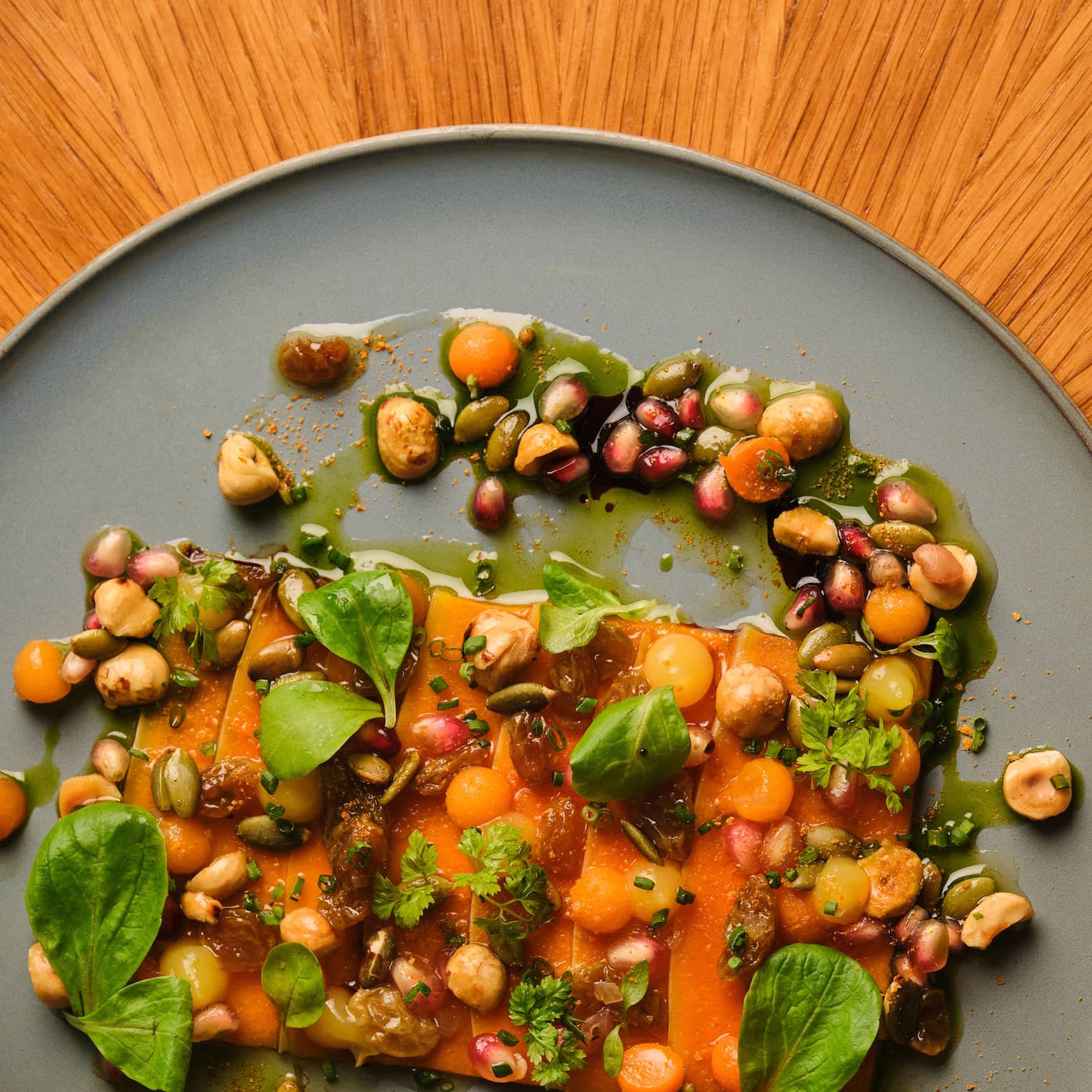Squash dish with leafy greens on a plate