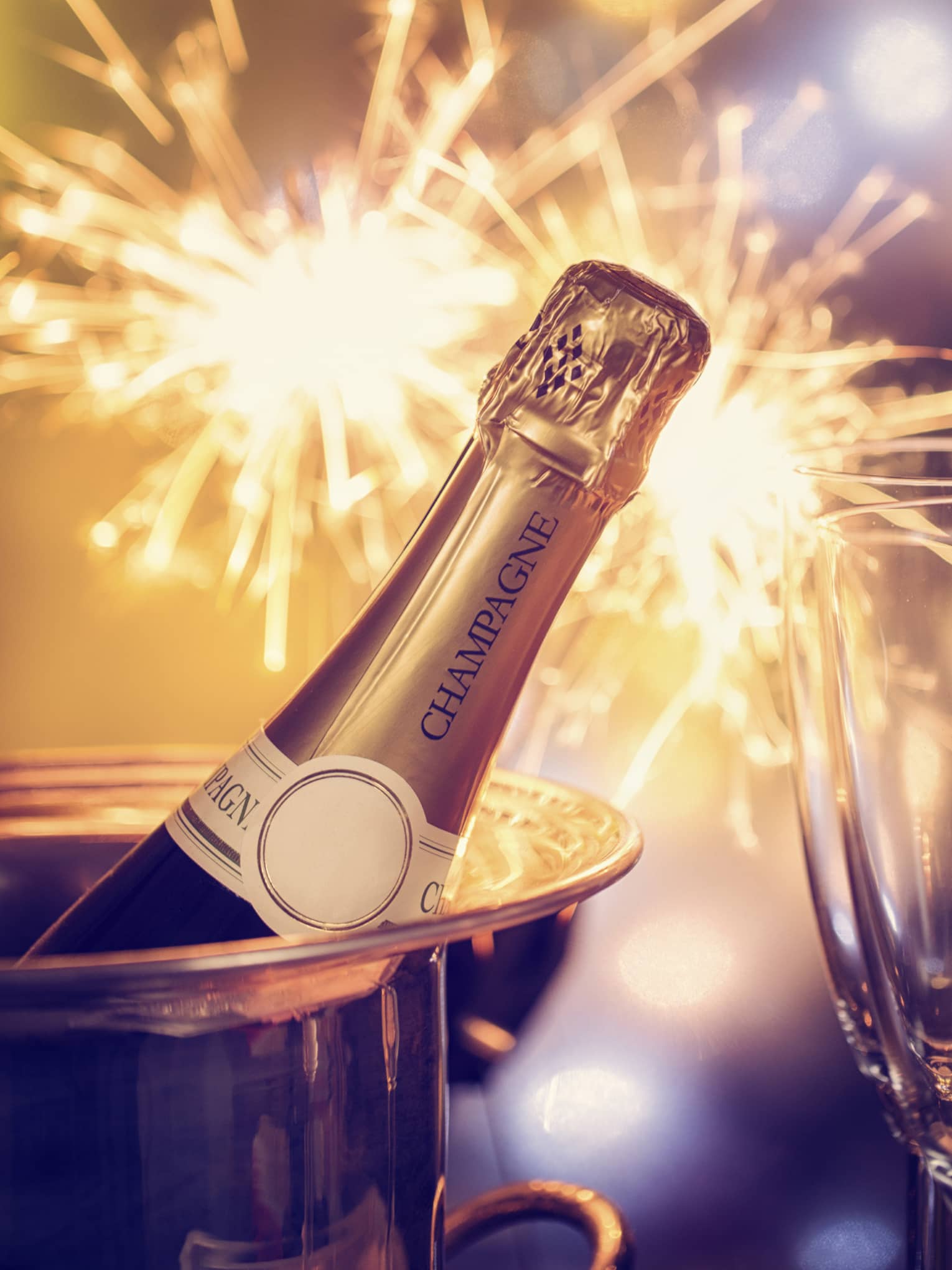 Fireworks, champagne and two champagne flutes
