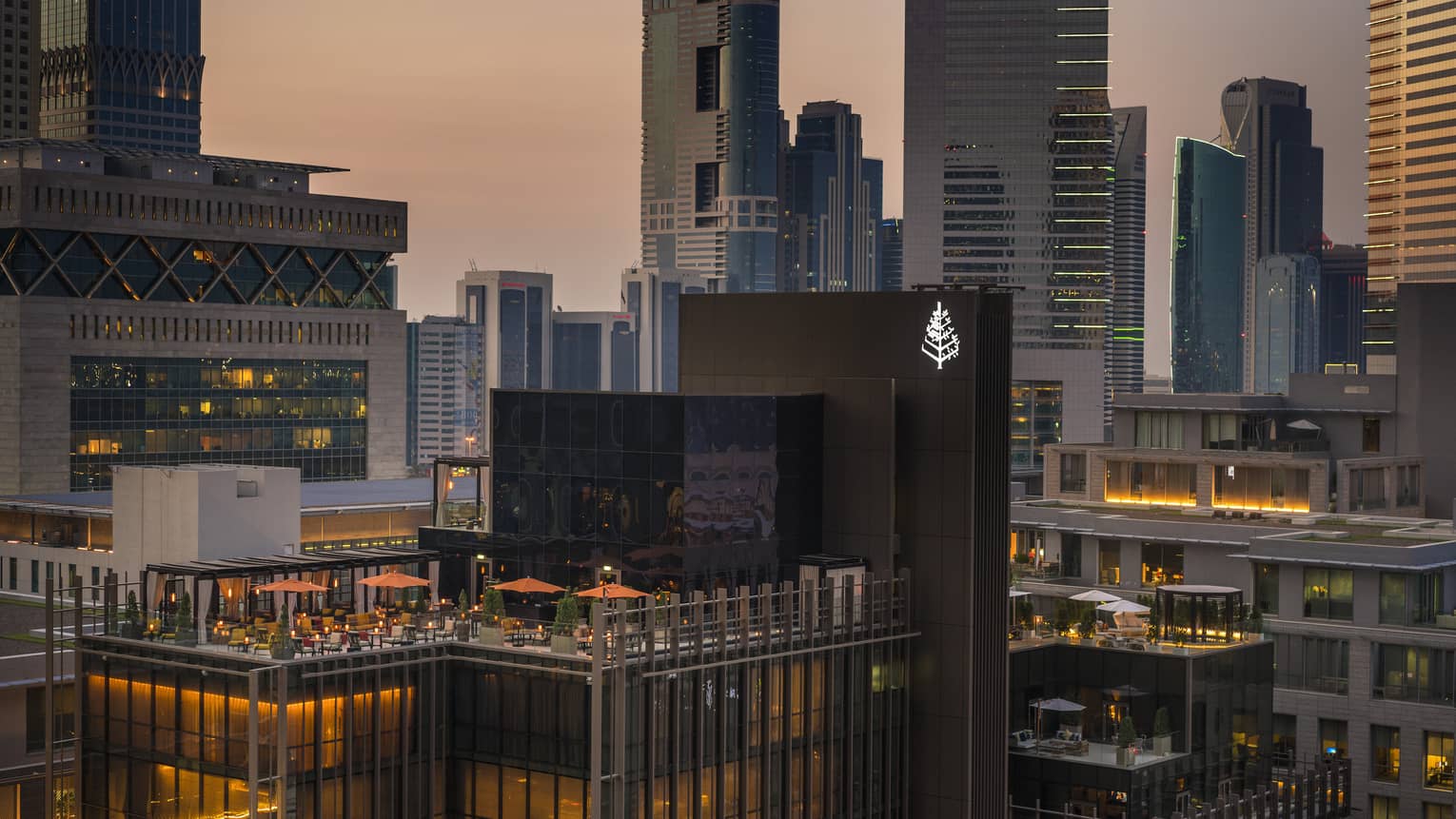 Exterior view of the rooftop of Four Seasons Hotel Dubai International Financial Centre with the skyline in the background