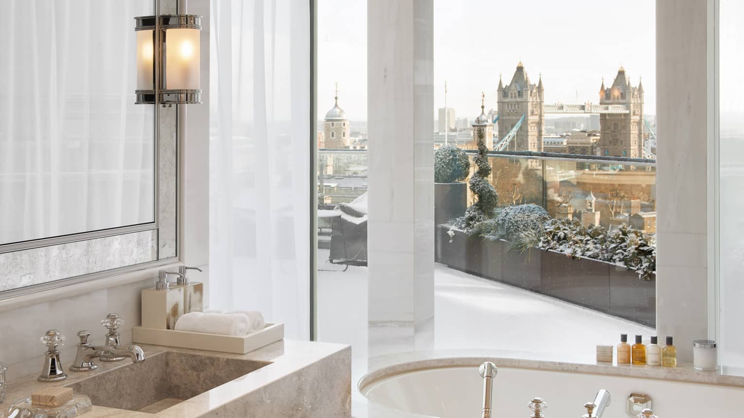 Penthouse Suite bathroom with windowside bath tub looking out to Tower Bridge ? Four Seasons Hotel London at Ten Trinity Square