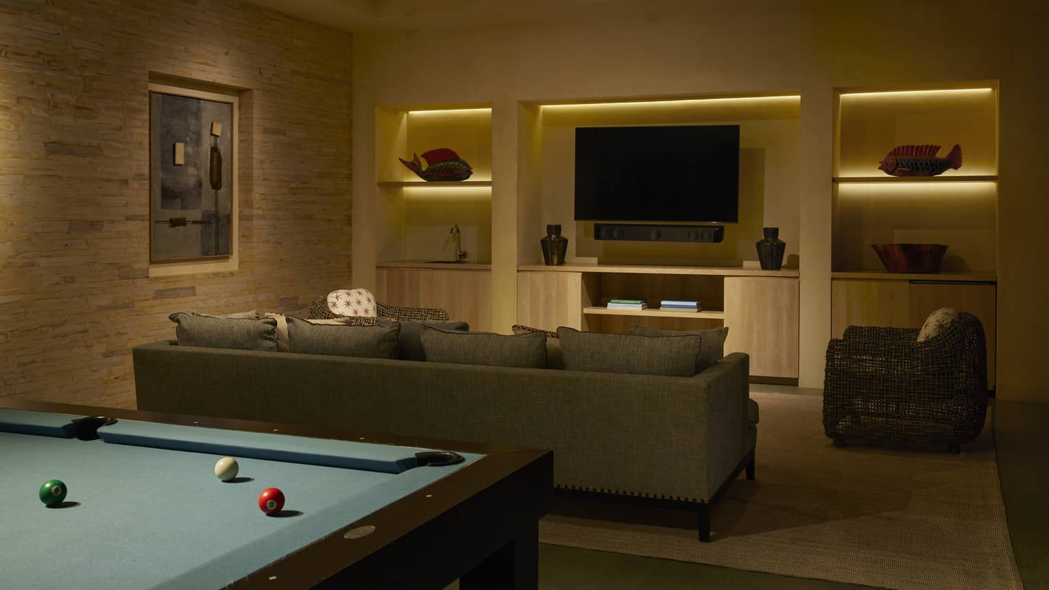 Media room with pool table, sofa and TV