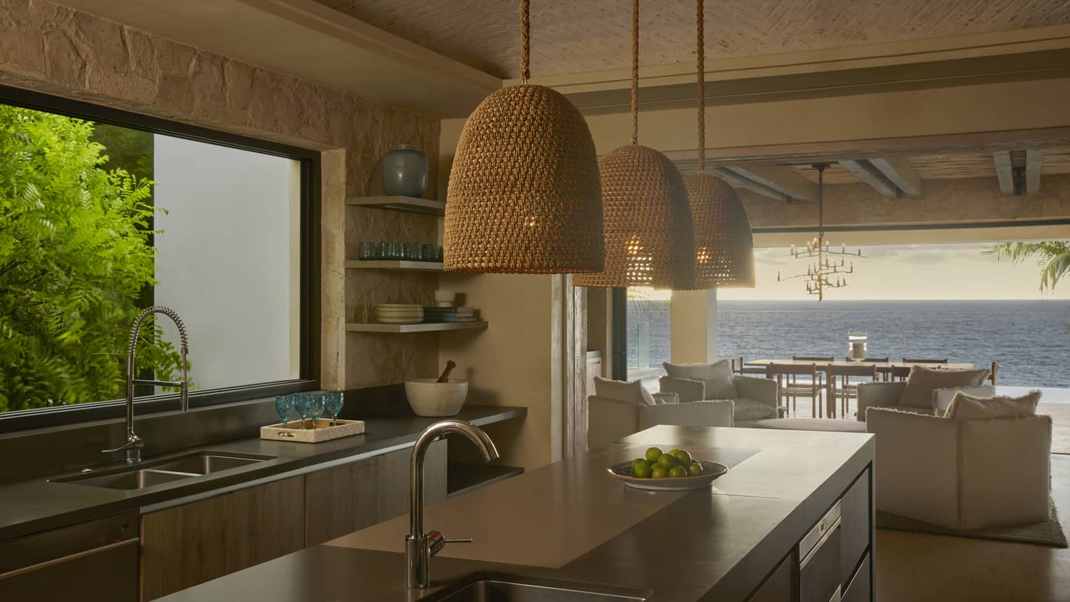 Contemporary kitchen opening up to ocean-view terrace