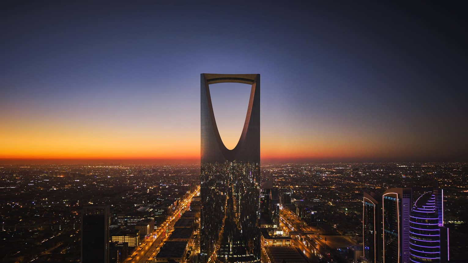Exterior view of Kingdom Tower at sunset