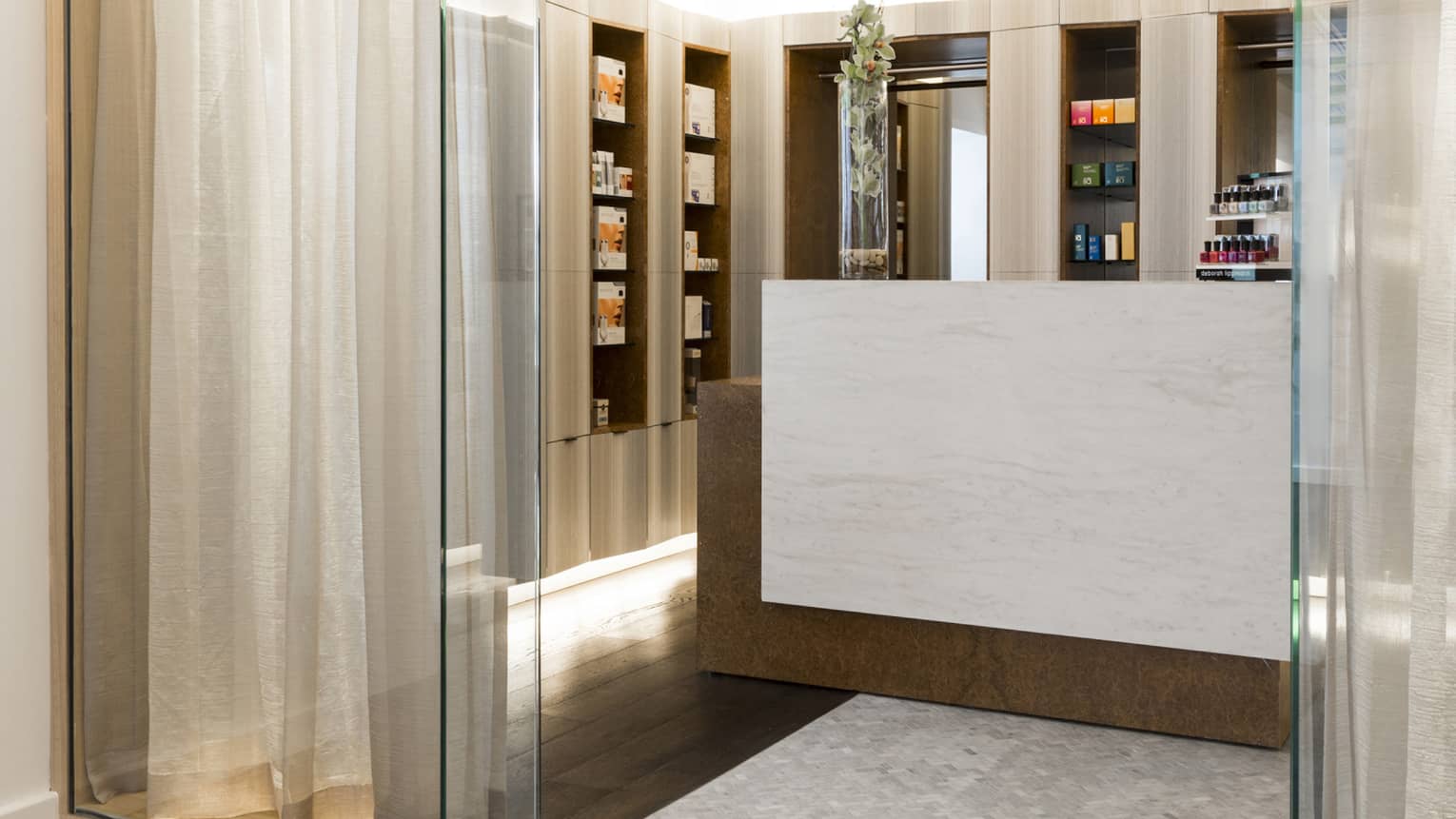 The entrance to the Spa lobby with curtains in a glass enclosure