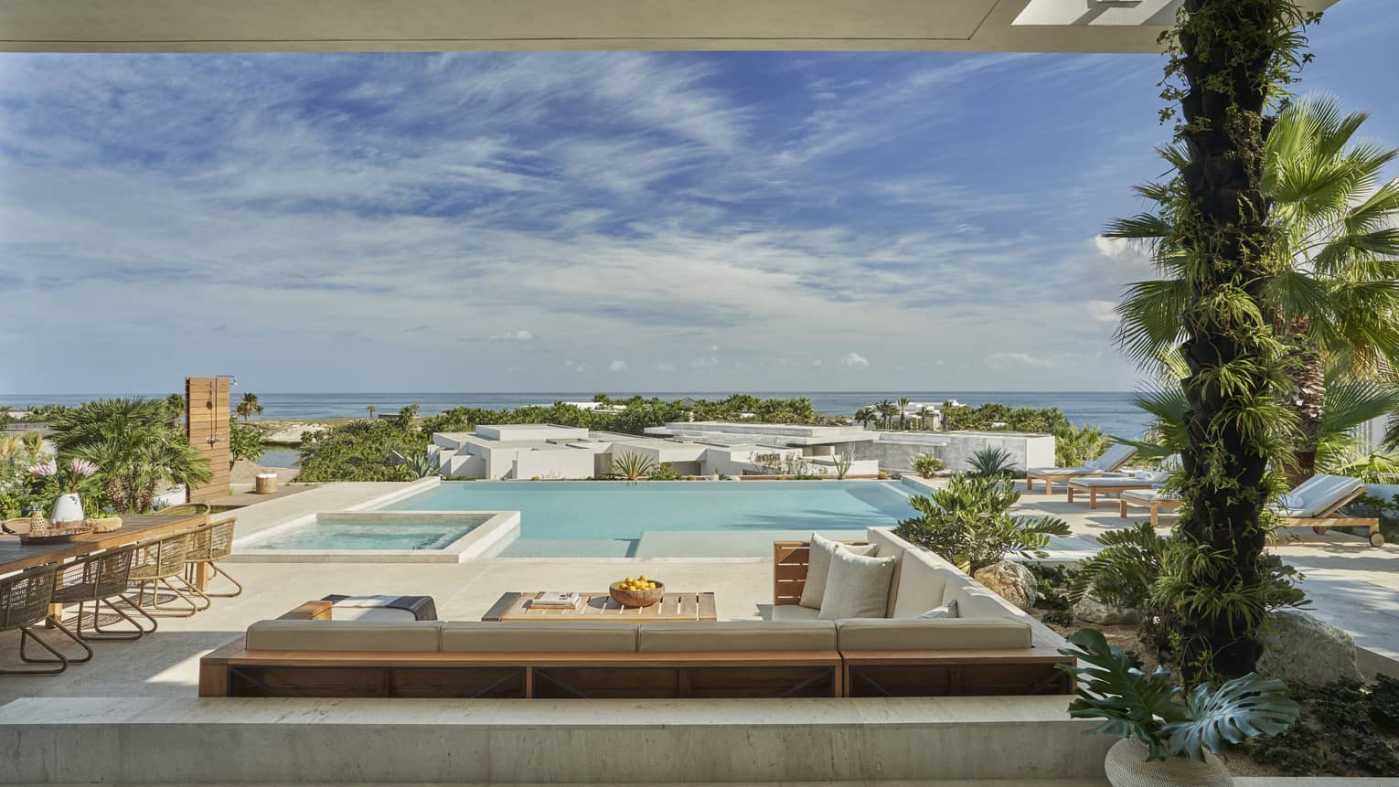 View of a private villa terrace with pool, lounge area and dining table, at Four Seasons Resort and Residences Los Cabos