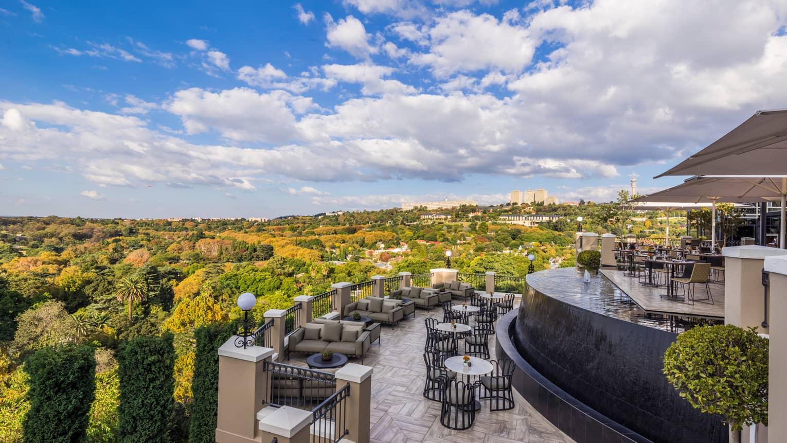 Curved View Restaurant patio overlooking green trees, forest