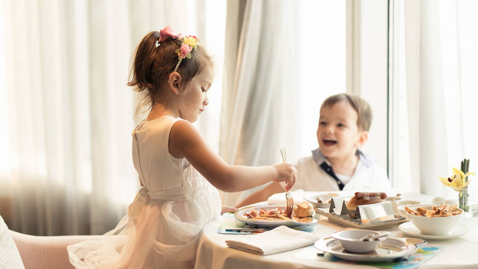 Kids enjoying a breakfast buffet at the family hotel, Four Seasons Hotel Hong Kong,Kids enjoying a breakfast buffet at the family hotel, Four Seasons Hotel Hong Kong