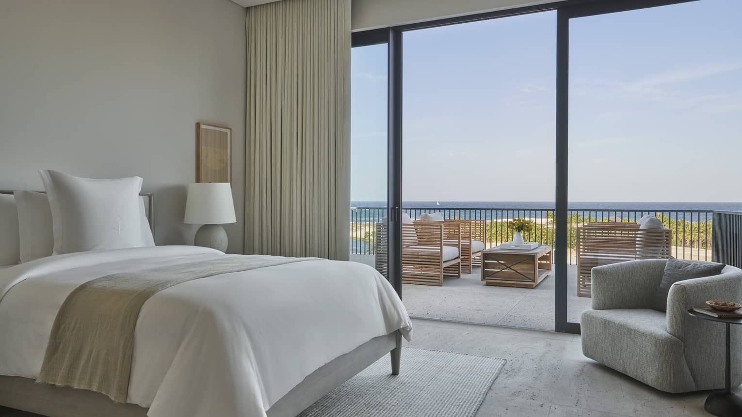 Villa bedroom with queen bed and walk-out terrace at Four Seasons Resort and Residences Los Cabos