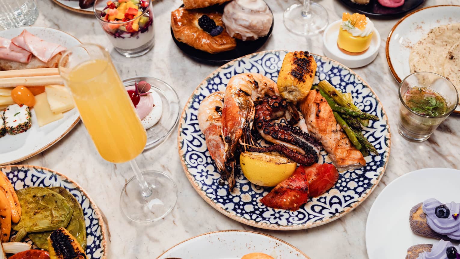 Brunch dishes and a mimosa on a table