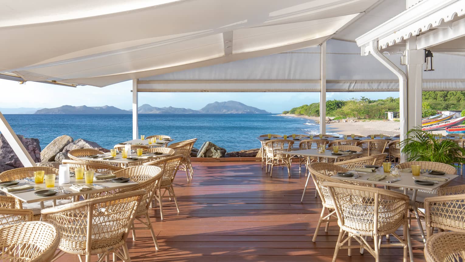 An outdoor dining area with views of the ocean