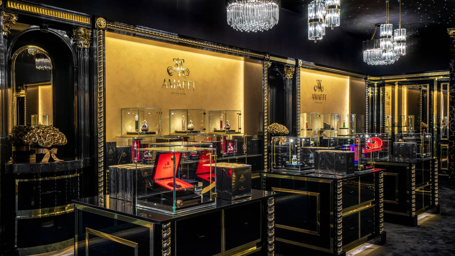 AMAFFI boutique interior with glass cases and crystal chandeliers