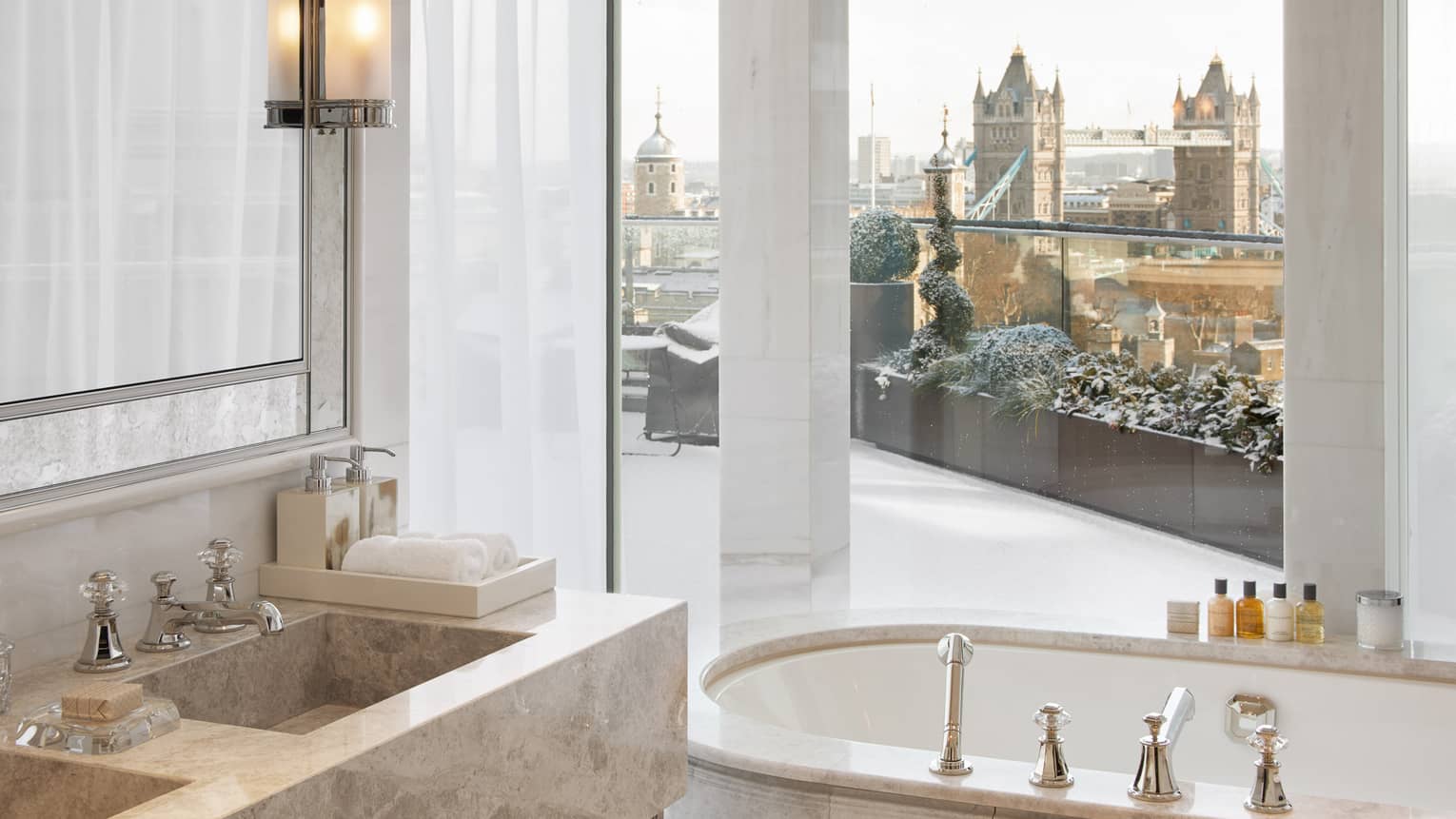 Penthouse Suite bathroom with windowside bath tub looking out to Tower Bridge ? Four Seasons Hotel London at Ten Trinity Square