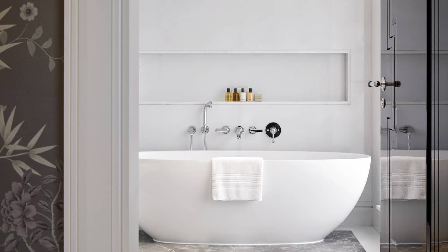 Penthouse Suite bathroom with standalone deep soaking tub at Four Seasons Hotel London at Ten Trinity Square