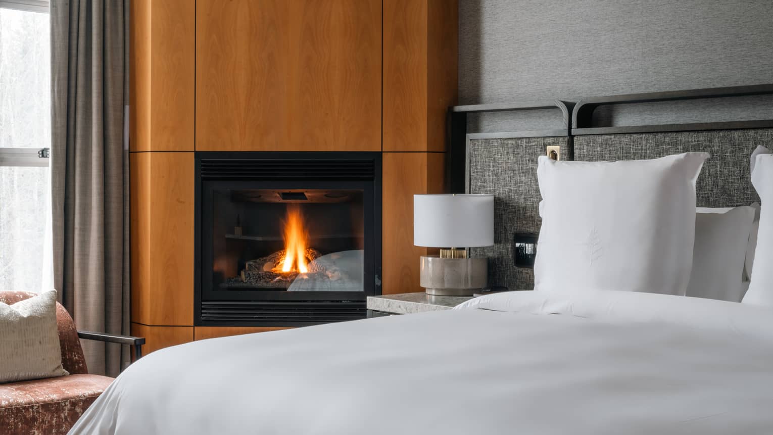 Guest room bed and fireplace