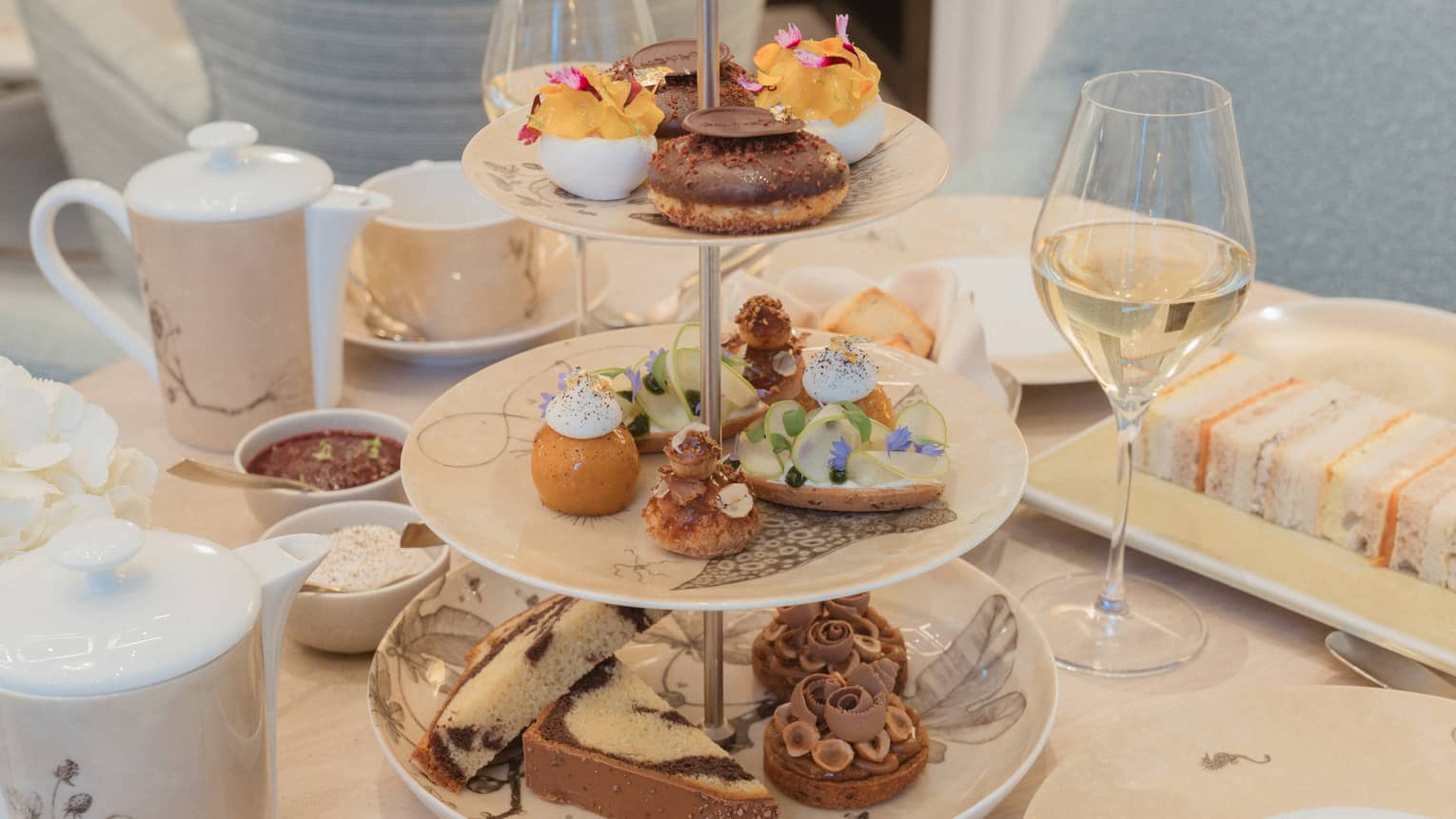Afternoon tea stand filled with assorted treats and bites
