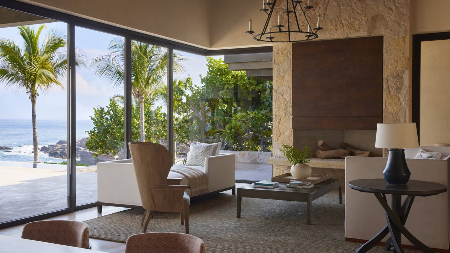 Contemporary living area with walk-out, ocean-view pool terrace