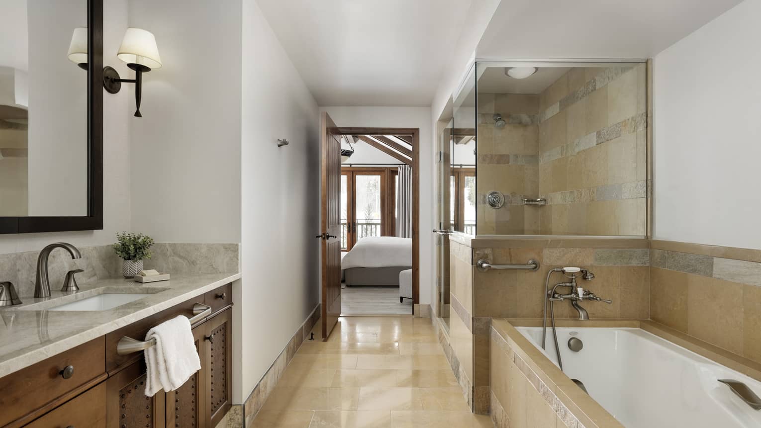 Bathroom with limestone tiles, separate tub and shower