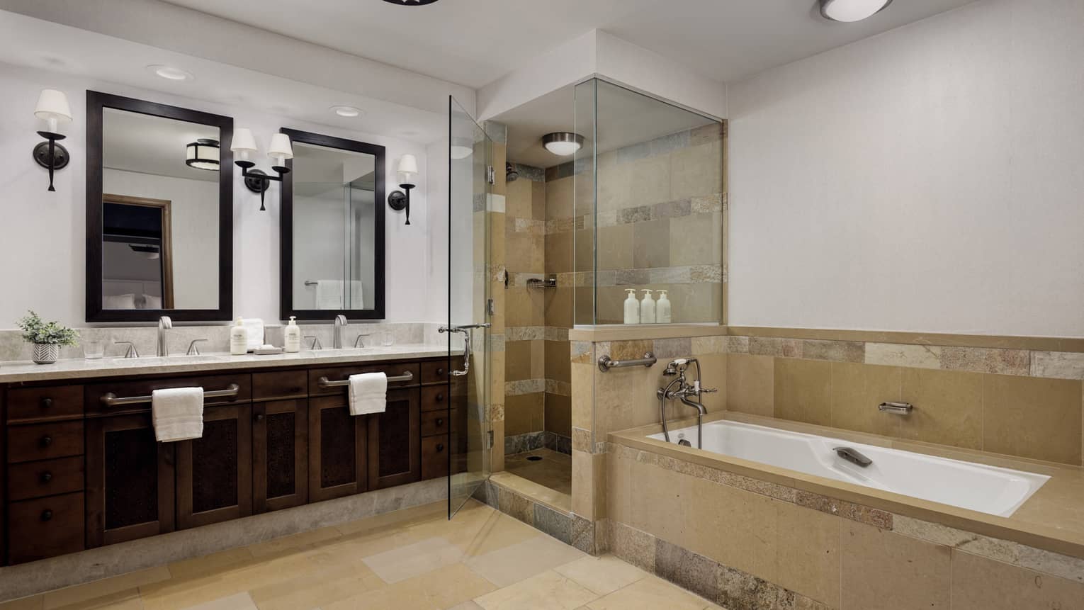 Bathroom with double vanity and separate shower and tub