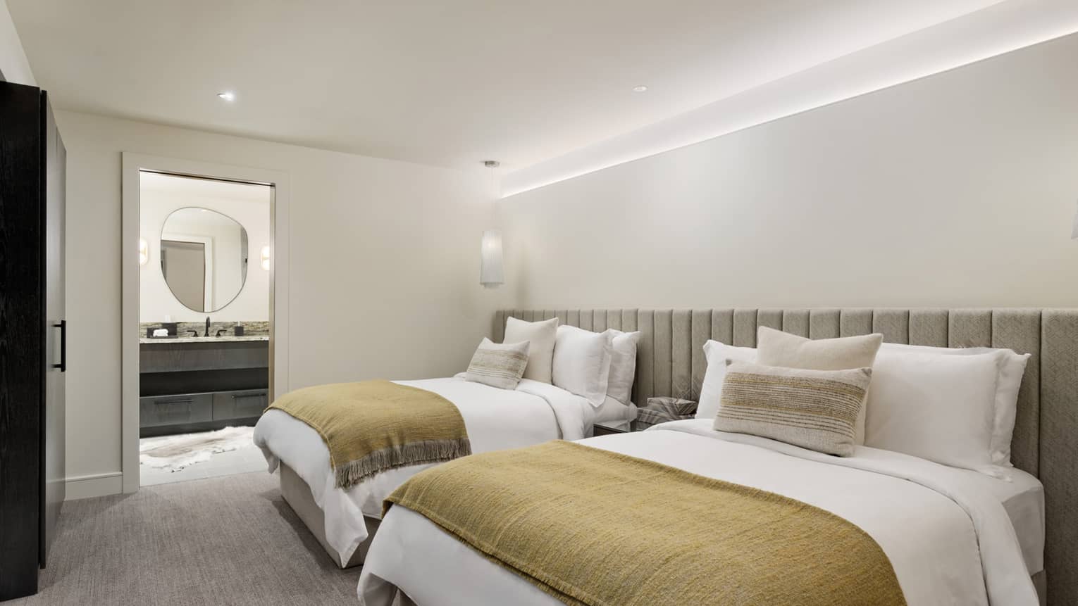 Luxury residence bedroom with two queen beds and private bathroom, Lover's Leap at Four Seasons Resort and Residences Vail