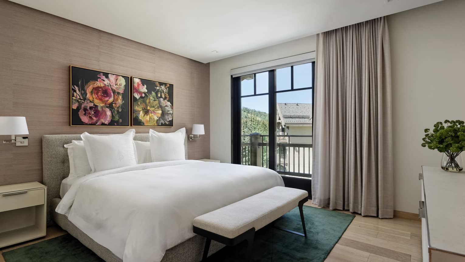 Bedroom with king bed, flower artwork and balcony at Four Seasons Vail