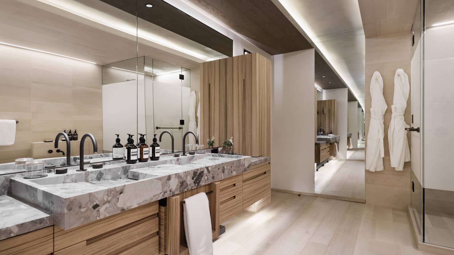 Large modern bathroom with double vanity and shower
