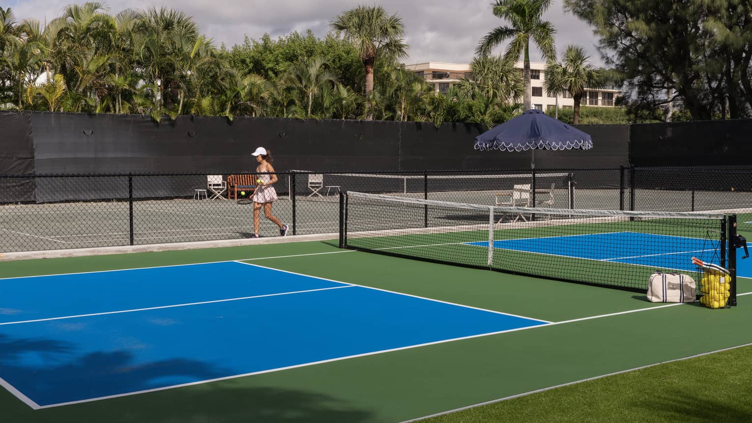 Two pickleball courts and a tennis court
