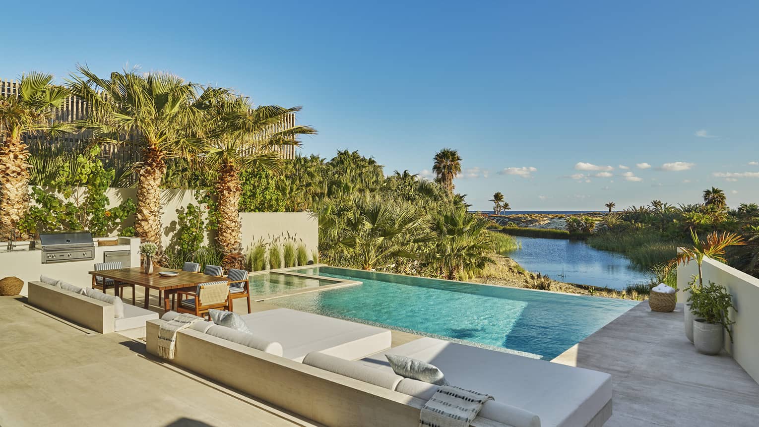 Private villa pool and pool deck in tropical setting at Four Seasons Resort and Residences Los Cabos