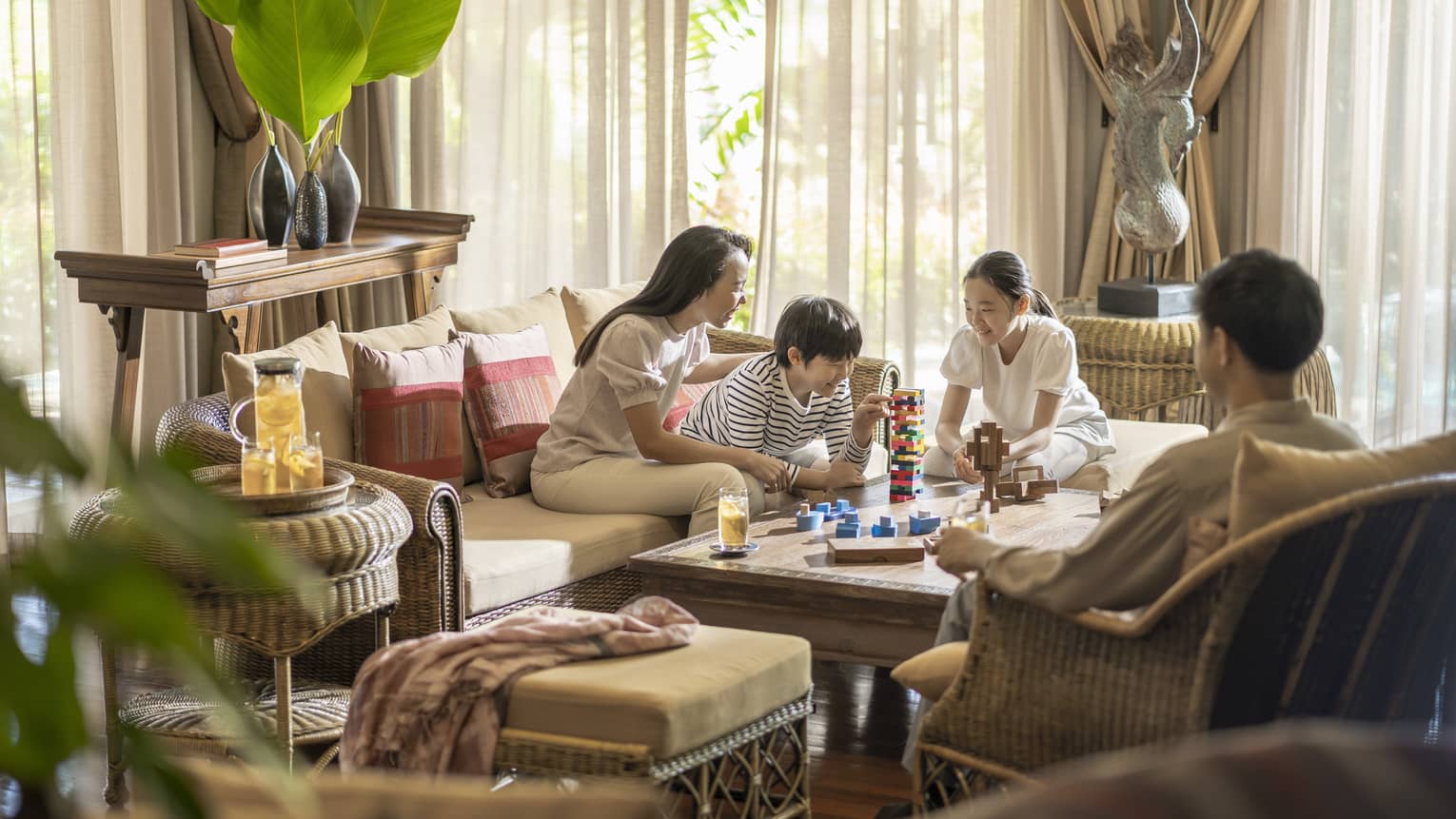 Family of four plays games in their residence