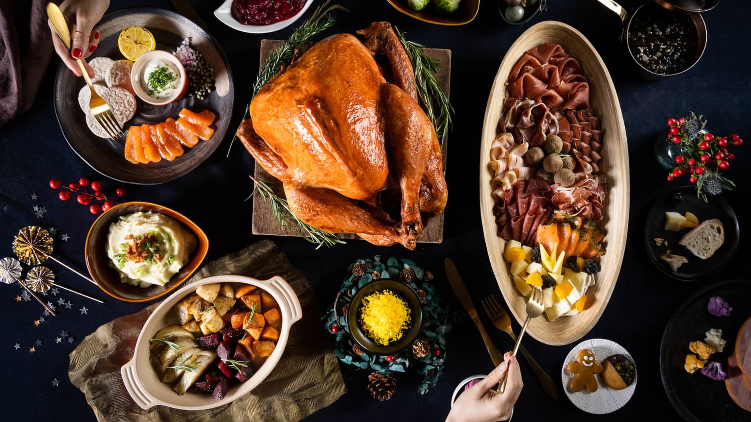 Aerial view of table with roasted turkey and various side dishes