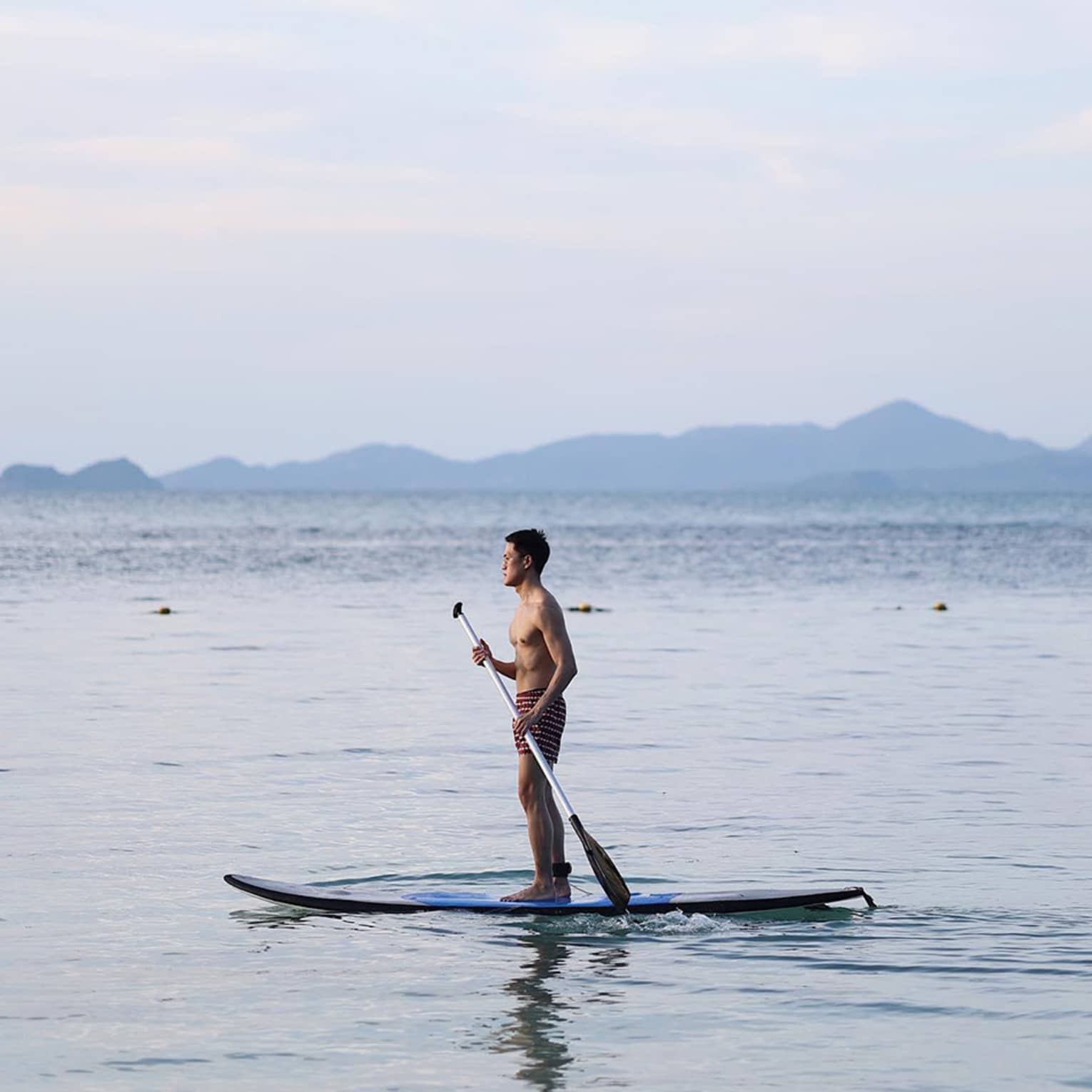 Man paddleboarding