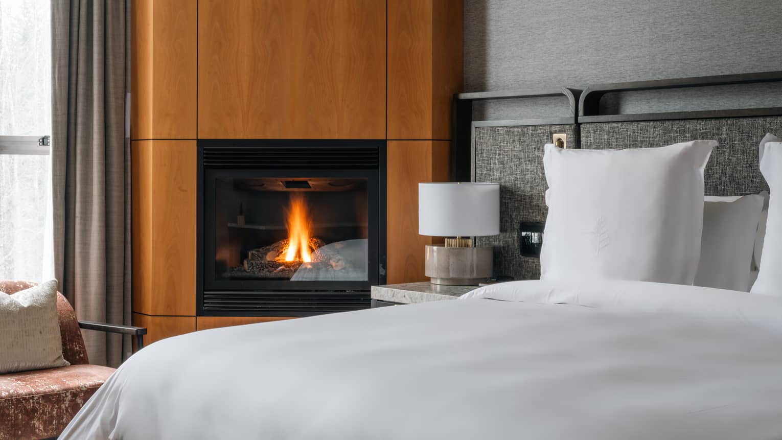 Guest room bed and fireplace