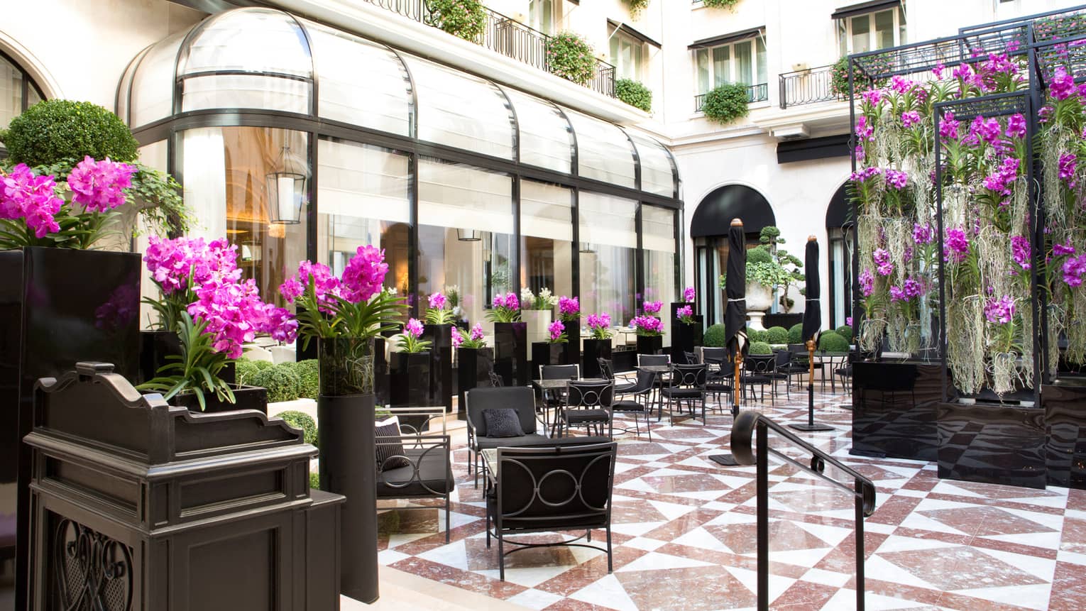 Elegant courtyard with purple flowers at luxury hotel