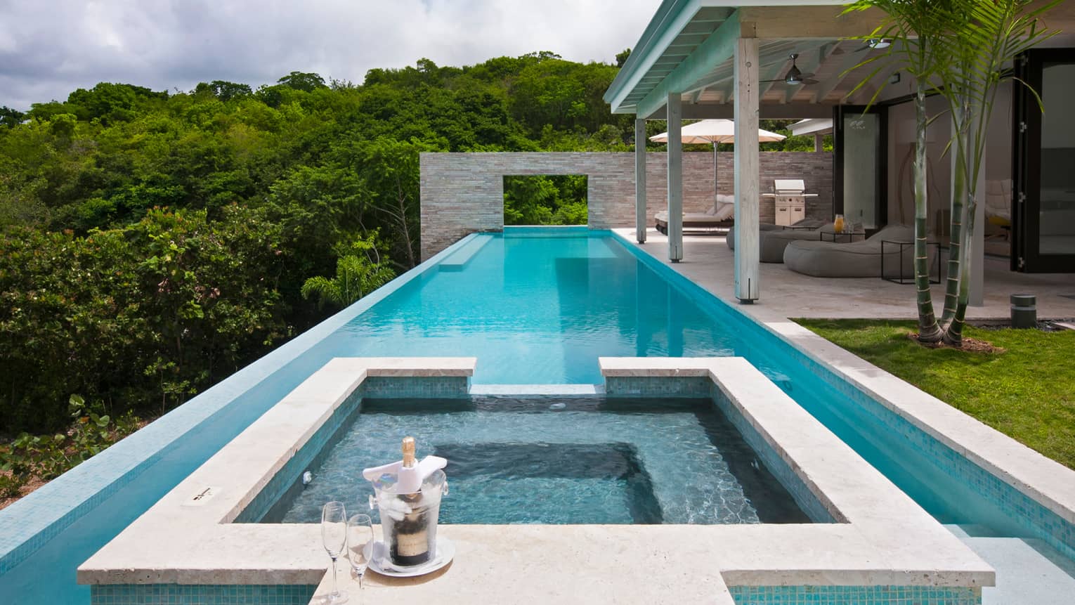 champagne by outdoor swimming pool