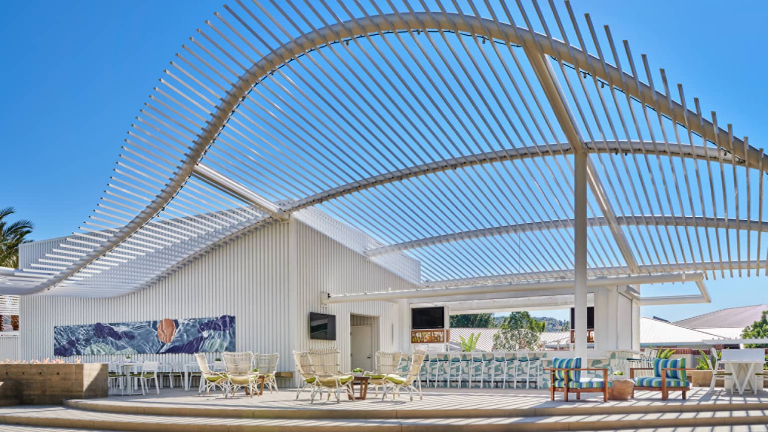 An outdoor sitting area under a blue sky.