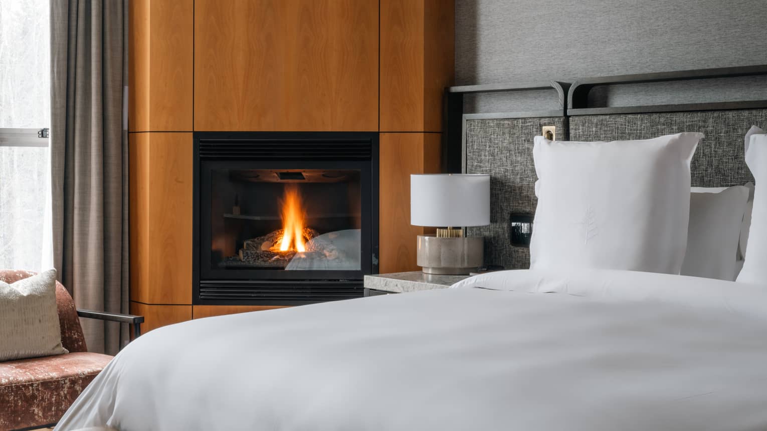 Guest room bed and fireplace