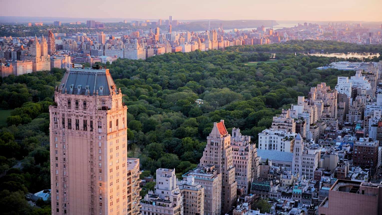 Looking down over historic buildings, Central Park in Manhattan, New York at sunset