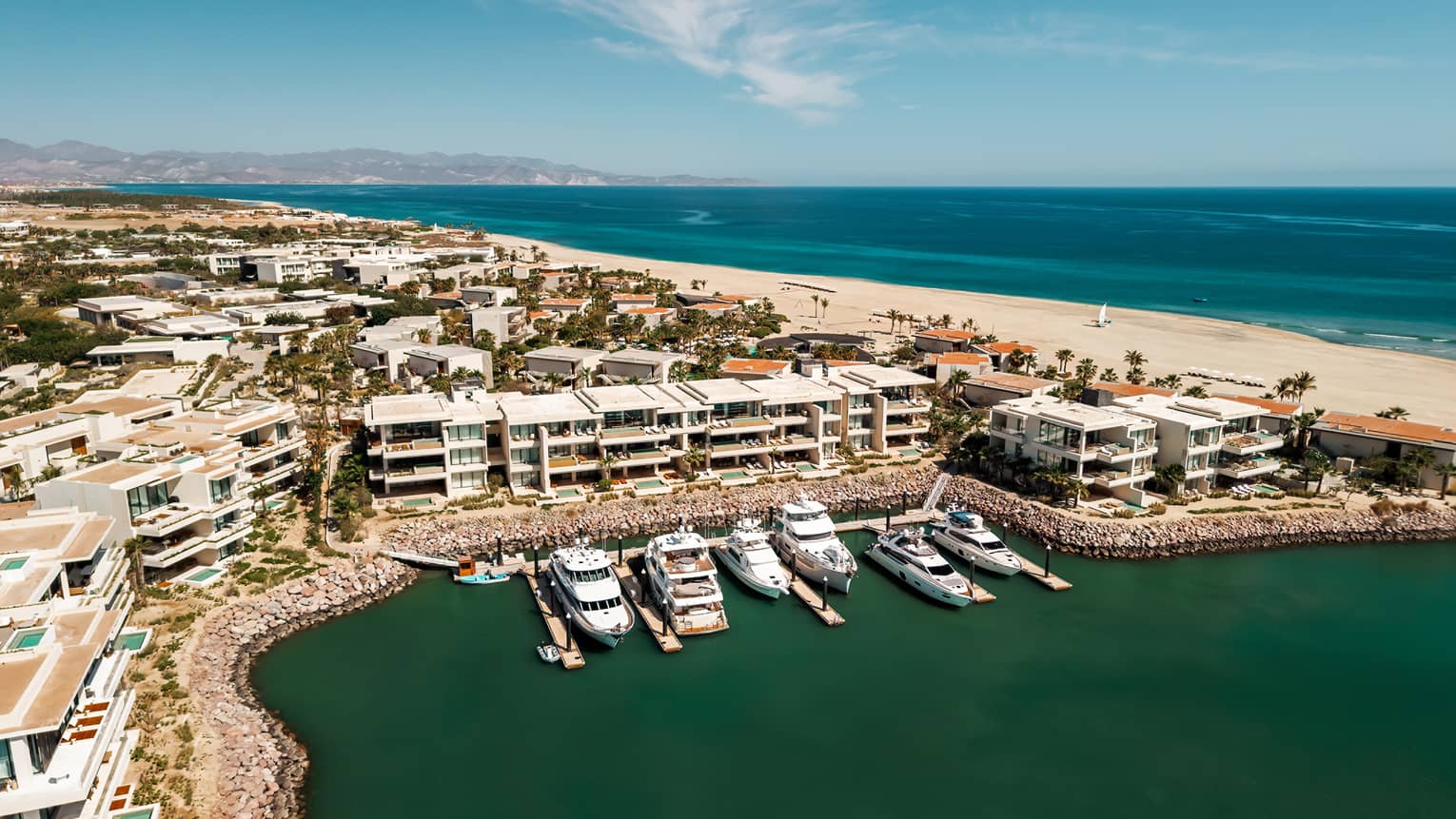Aerial view of marina and beach in the distance