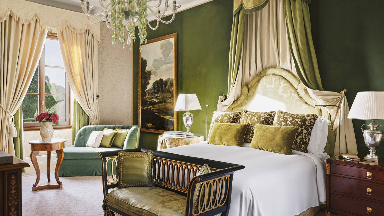 Executive Suite bedroom with king bed, green walls and chaise, chandelier and window with cream curtains, at Four Seasons Hotel Florence