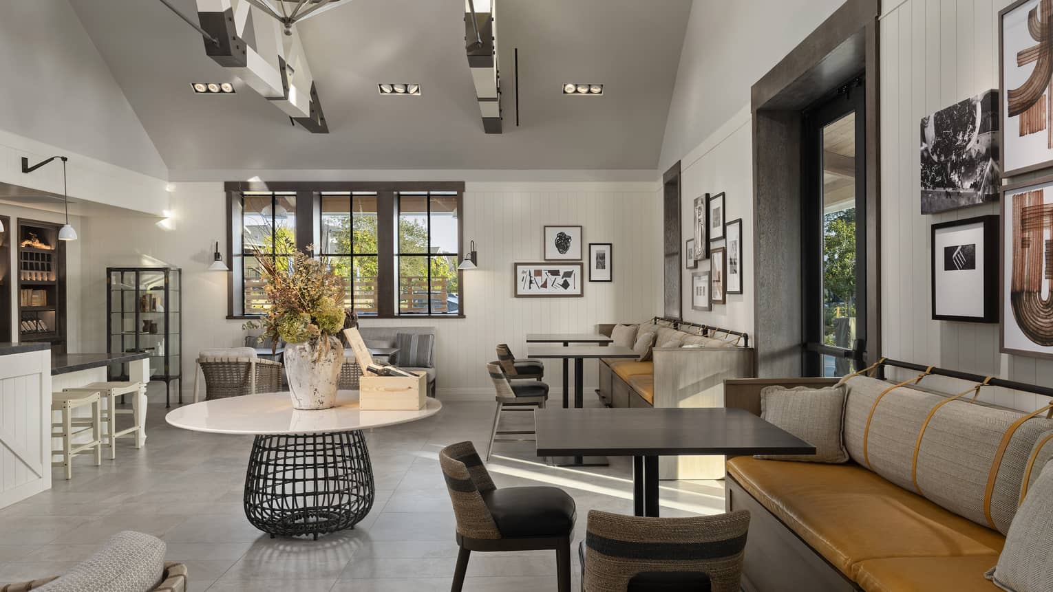 A large room with many seats and an eclectic style.