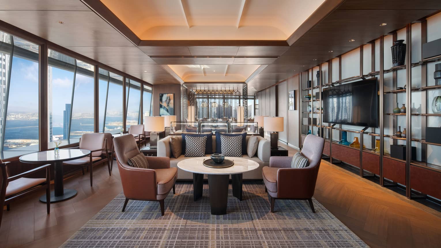 Sleek hotel executive lounge area with elevated city views of Dalian, China