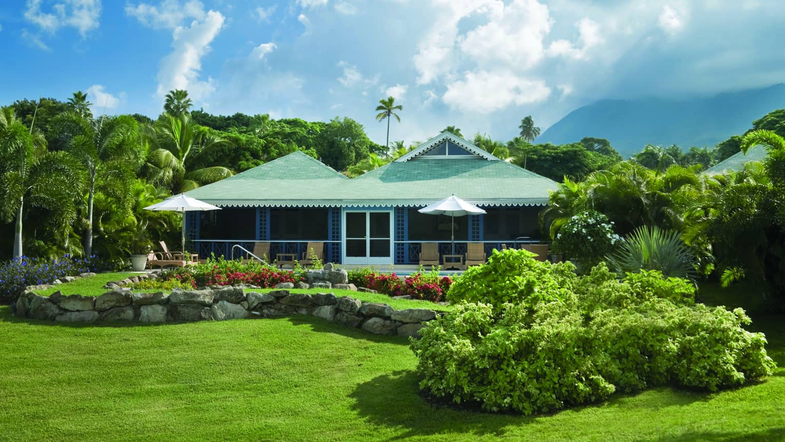 Exterior of Villa 1408, surrounded by lush gardens