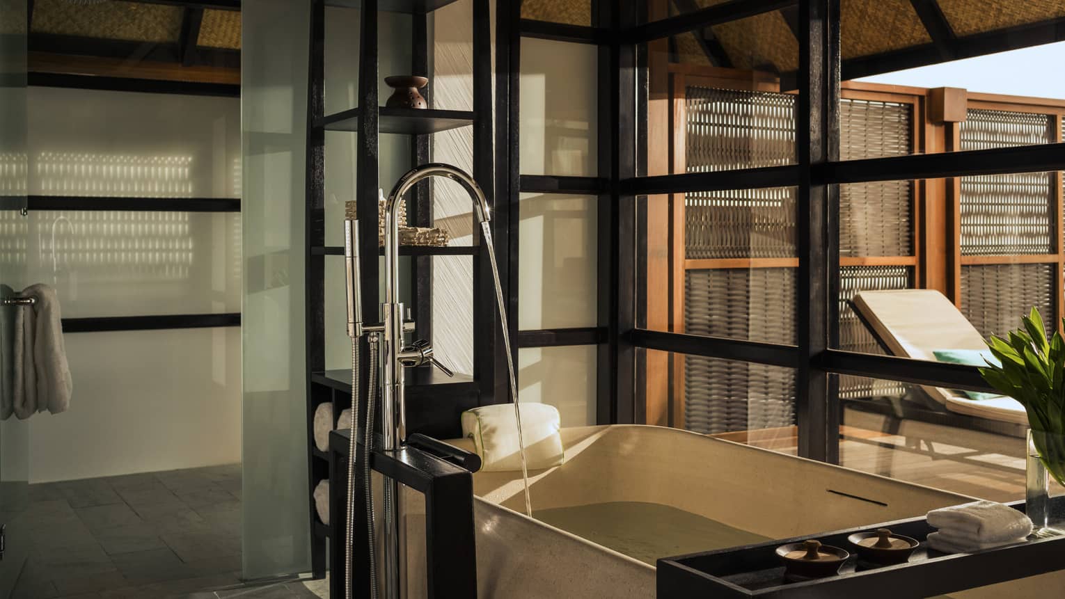 Luxury bathroom in a sunset water villa with pool