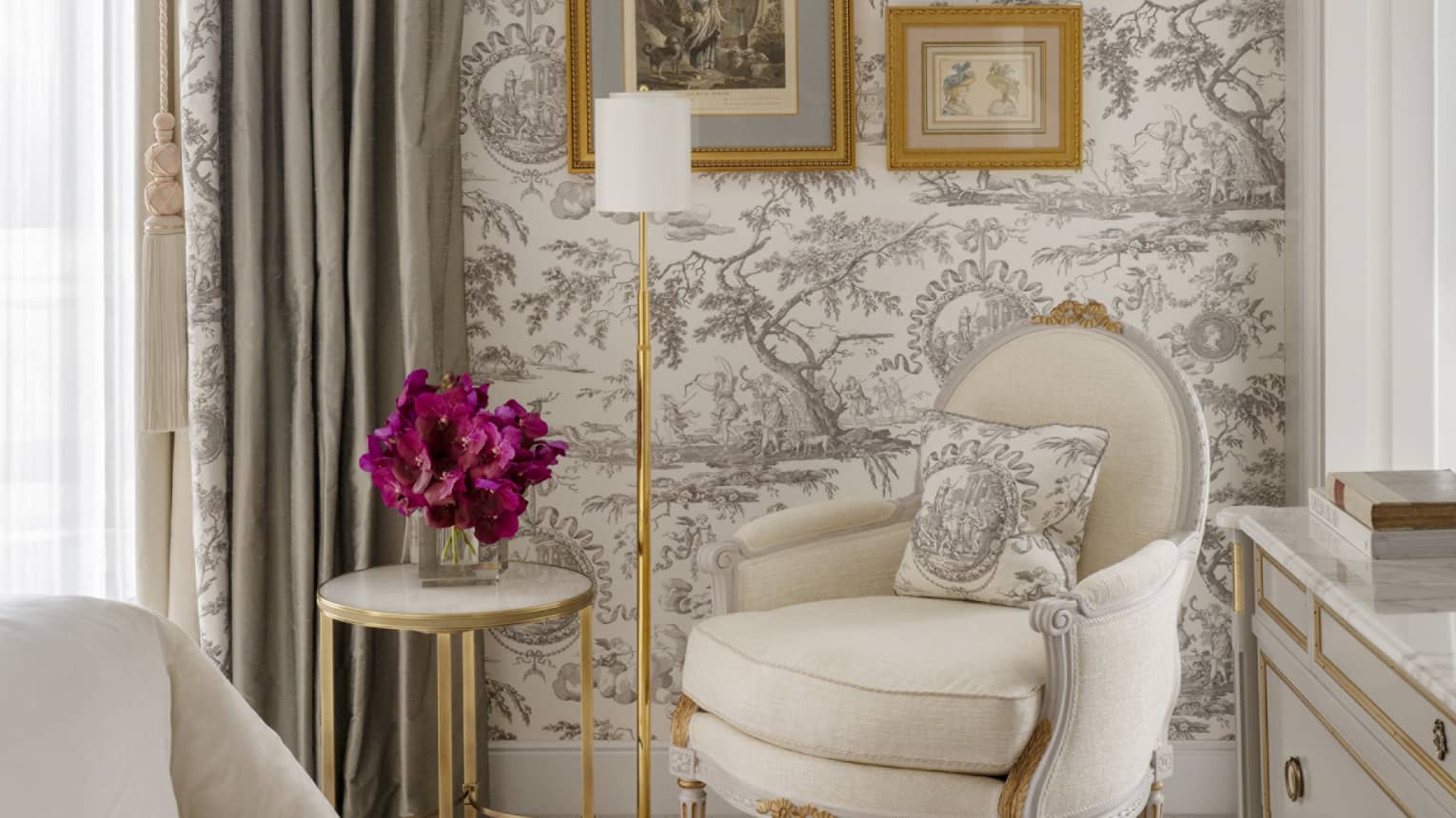 Grand Premier Suite bedroom arm chair, French wallpaper, side table and purple floral arrangement, at Four Seasons Hotel George V, Paris